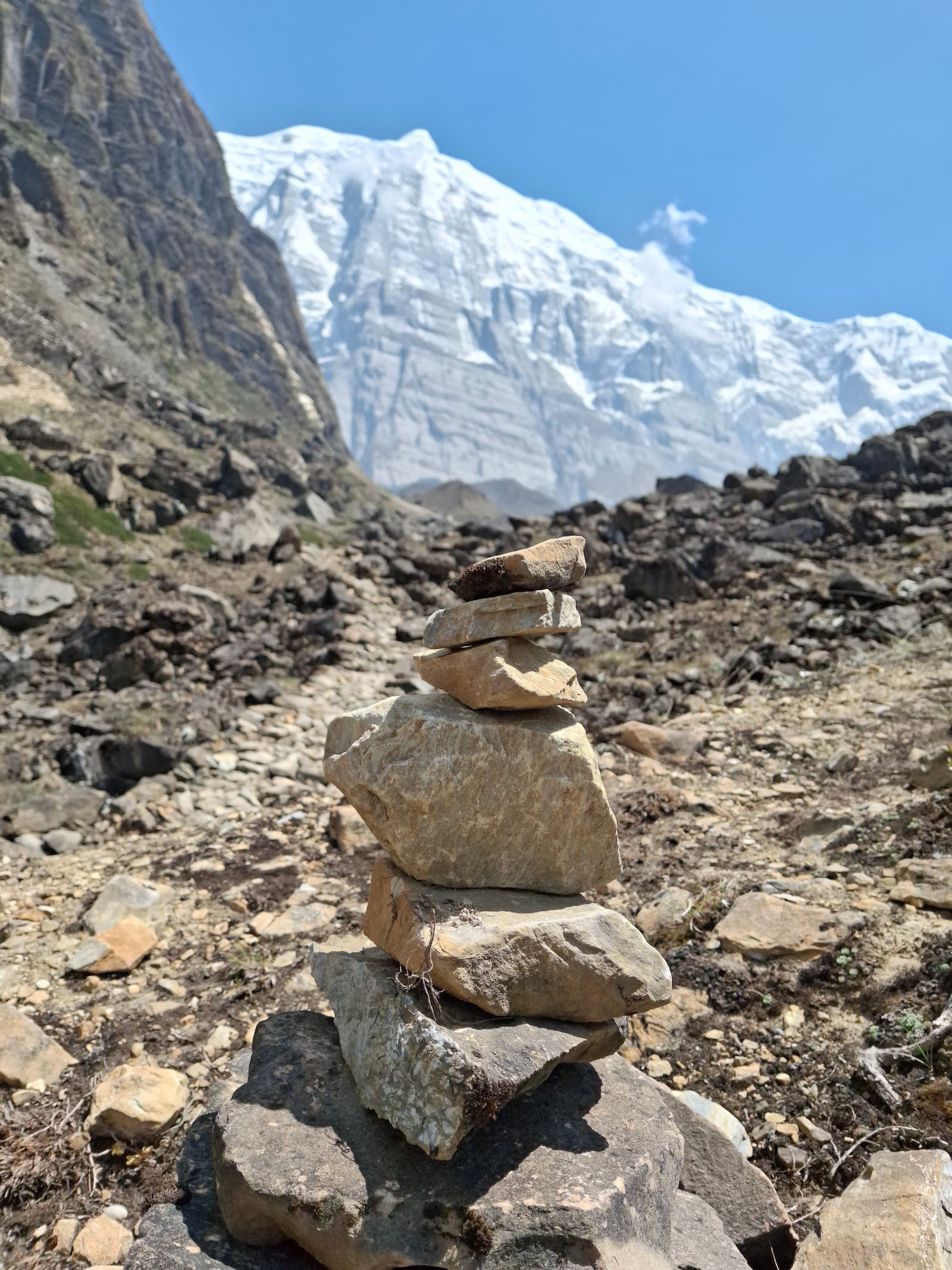 Prayer cairns and stones arranged on the mountain trail to Annapurna